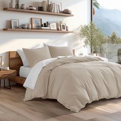 a bed sitting on top of a hard wood floor next to a wooden shelf filled with books