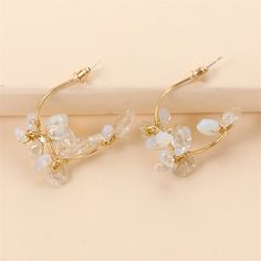 Frame your face with the sparkling elegance of this pair of flower drop earrings made with clear resin and an 18k gold plating. 1.46'' W x 1.46'' L 18k gold-plated copper / resin Flower Drop Earrings, Flower Plates, Clear Resin, Gold Plating, 18k Gold, Pearl Earrings, Gold Plate, Copper, Sparkle