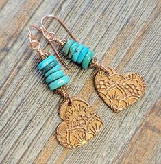 Handmade Artisan Copper Precious Metal Heart Earrings wire wrapped with fabulous Hubei Turquoise Gemstones.  They dangle from handmade copper lead and nickle free ear wires.   Original One of a Kind handmade earrings:  *  Handmade Copper Stamped PMC Heart Charms - Artisan Metal Work *  Hubei Disc Turquoise Gemstones - High End Turquoise *  Copper Spacer Beads *  Copper Handmade Ear Wires - Lead and Nickel Free  *  Wire Wrapped with Copper Wire *  Small Petite Size Earrings Earrings measure appro Green Heart-shaped Bohemian Earrings, Bohemian Dangle Heart Earrings With Heart Beads, Bohemian Heart Bead Dangle Earrings, Bohemian Heart Beaded Dangle Earrings, Bohemian Turquoise Heart Jewelry, Handmade Bohemian Dangle Heart Earrings, Adjustable Bohemian Heart Earrings, Turquoise Heart Beads Dangle Earrings, Bohemian Nickel-free Heart Earrings