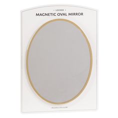 the magnetic oval mirror in white and gold is shown on a cardboard package with an adhesive