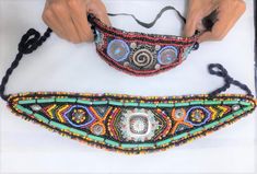 Discover the essence of Moroccan craftsmanship with our Handmade Beaded Traditional Moroccan Belt, a stunning accessory designed to make Amazigh women bloom and shine like a flower. These belts are perfect for traditional events like the Ahwash dance, combining rich cultural heritage with intricate artistry.   Our Story and Craft Hand beading is a timeless tradition passed down through generations in Morocco. Each belt is a labor of love, crafted by skilled artisans who meticulously stitch each Festival Multicolor Embroidered Beaded Bracelets, Multicolor Embroidered Beaded Bracelets For Festival, Traditional Beaded Necklaces With Colorful Beads For Festival, Traditional Multicolor Beaded Necklaces For Ceremonies, Traditional Handmade Beaded Bracelets For Festivals, Traditional Adjustable Beaded Bracelets For Festivals, Traditional Festival Beaded Necklaces, Traditional Beaded Necklace For Festivals, Adjustable Traditional Beaded Necklaces For Festivals