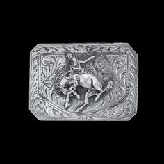 Featuring an immaculate centennial bronc figure set over phenomenal hand engraving, this trophy buckle is an elegant piece fit for any belt. This buckle is a channel style so there is an engraved lip on the top and bottom edges making it three-sided, giving the leather strap a "channel" to pass through, and measures 1 5/8" in height and 2 1/2" across. See our Vogt belt collection to find the perfect match for this buckle. All Vogt sterling items come with the Vogt Family's Unconditional Lifetime Antique Engraved Belt Buckles For Formal Wear, Classic Concho Belt Buckles For Rodeo, Classic Hand Tooled Belt Buckles For Western-themed Events, Elegant Hand Tooled Belt Buckles For Formal Occasions, Elegant Hand Tooled Belt Buckles For Formal Wear, Elegant Formal Hand-tooled Belt Buckles, Classic Silver Hand-tooled Belt Buckle, Classic Hand Tooled Silver Belt Buckles, Western Engraved Belt Buckles For Formal Wear