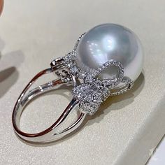 Luxury Vintage Pearl Ring For Women, Luxury Elegant Pearl Ring With Round Band, Luxury Oval Rings With Pearl Drop, Luxury Elegant Pearl Ring, Luxury Pear-shaped Pearl Ring For Formal Occasions, Luxury Vintage Pearl Ring For Formal Events, Luxury Fine Jewelry Pearl Ring With Round Band, Luxury Heirloom Pearl Ring For Gift, Luxury Fine Jewelry Pearl Ring For Anniversary