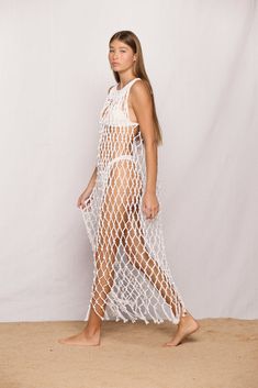 Description Details Care Return Sometimes less is more. Introducing the Bellano Dress. We might be biased, but this is easily the hero piece of our entire collection. Featuring a maxi length, bottom fringe detailing, and an all around wow factor for anyone who puts this on. Add to cart and checkout as fast as you can. This stunning, statement piece deserves to be worn over and over. This is what macrame dreams are truly made of.  The Bellano Dress is part of our macrame collection which offers three different length pieces that suit whichever style and occasion you decide to dress for.  Featured with Kumu 2 Top, Chiba Top, Papara Bottom and Malta One Piece HOW WE WEAR IT Chiba Papara Bellano Macrame Maxi Dress 100% Cotton Made in Indonesia Models wears size 1 Model is 5'9" / 175cm Bra size Vacay Vibes, Net Dress, Wow Factor, Less Is More, Dress 100, Dress Romper, We Wear, Swimwear Tops, Festival Fashion