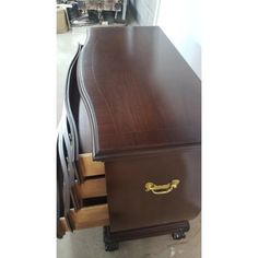 a large wooden desk with drawers on it