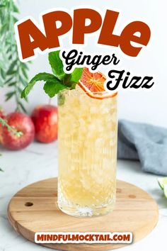 an apple ginger fizz cocktail on a cutting board