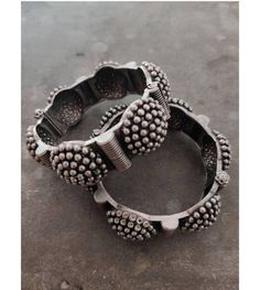 "\"Grab this beautiful black polish Kada and match it with any of the ethnic/ Indo western outfits, and look unique in crowd. This Kada/bracelet combines intricate detailing in a geometric line motif and contemporary design to help you make heads turn. The technique of oxidization has been used to give a dull sheen and bring out the exquisite design. This beautiful German silver bracelet is free of lead and nickel. These gorgeous pieces won't cause any skin rash or irritation. This bracelet is o Festival Metal Bangle With Oxidized Finish, Traditional Round Beaded Bracelets For Festival, Bohemian Tilla Bangle Bracelet, Fusion Style Silver Bracelets For Festival, Silver Fusion Style Bracelets For Festival, Traditional Navratri Festival Bracelets, Silver Fusion Bracelets For Festivals, Bohemian Metal Bangle With Intricate Design, Bohemian Bracelets For Navratri Festival