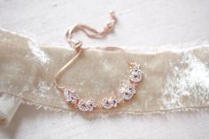 Our delicate rose gold wedding bracelet features sparkly cz stones that effortlessly add a touch of shine to any look! - Bracelet has an adjustable slide clasp that will fit most wrist sizes - Available in rose gold and rhodium (silver) finishes - Handcrafted with high quality cubic zirconia Browse My Entire Shop For More Jewelry & Accessories: https://www.etsy.com/shop/TheExquisiteBride Browse My Shop For Earrings: https://www.etsy.com/shop/TheExquisiteBride?section_id=14483895 Browse My Sh Delicate Rose Gold Cubic Zirconia Bracelets, Elegant Wedding Diamond Bracelet With Adjustable Chain, Elegant Sparkling Rose Gold Bracelet, Adjustable Rose Gold Bracelets For Wedding, Delicate Rose Gold Bracelets For Party, Sparkling Rose Gold Anniversary Bracelets, Adjustable Rose Gold Diamond Bracelet For Parties, Delicate Rose Gold Bracelets For Bridesmaids, Delicate Rose Gold Bracelet For Bridesmaids