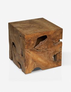 a small wooden box with holes in the middle and one section cut out to look like an elephant