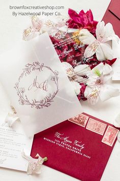 wedding stationery and envelopes with flowers on them