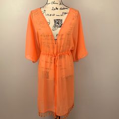 Nwt Ymi Swimwear Swim Cover Up Wrap Shawl Lightweight Sheer Tangerine With Lace / Tassel Trim Sheer/See-Through Cover-Up Open V Neckline Front Tie Waist Closure 100% Polyester Woman’s Size 3x Flat Lay Measurements (Drawstring Open) 25” Pit To Pit 36” Shoulder To Hem 1417/Kuw Casual Swimwear With Tassels For Vacation, Casual Vacation Swimwear With Tassels, Spring Vacation Swimwear With Tassels, V-neck Drawstring Cover-up For Vacation, Spring Open Front Cover-up With Tassels, Spring Festival Cover-up With Tie Waist, Spring Beachwear With Tassels, Casual Summer Cover-up With Tassel Ties, Spring Beachwear Cover-up With Tassel Ties