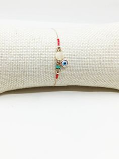 Evil eye Bracelet is adjustable, it fits on any wrist. Evil eye bead on the nazar bracelet is white. There are red miyuki beads on the nazar bracelet. Chain is rose gold. This beaded bracelet with evil eye would be a perfect gift for birthday, Christmas, Valentine's day or Mother's day. For more evil eye bracelets, click the link below; https://www.etsy.com/shop/EyeDesignsbyGG?ref=search_shop_redirect&section_id=30219689 White Beaded Bracelets With Adjustable Chain, Adjustable White Beaded Bracelet, White Friendship Bracelets With Evil Eye, White Beaded Bracelet With Adjustable Chain, White Evil Eye Friendship Bracelets, White Bohemian Evil Eye Bracelet For Friendship, White Beaded Bracelets With Adjustable Chain As A Gift, Bohemian White Evil Eye Bracelet For Friendship, White Bohemian Bracelet With Adjustable Chain