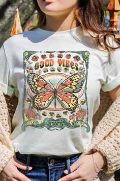 Spread good vibes with our Butterfly Graphic Tee! Made with high quality materials and a stylish design, this tee will make a statement wherever you go. The butterfly graphic adds a touch of beauty and positivity to your wardrobe. Feel good and look good with our Good Vibes Graphic Tee! Unisex Crew Neck Short Sleeve .High Quality Direct To Film Printed Graphic Design.100%COTTON,HEATHER(52%COTTON,48%POLY),ATH.HEATHER,BLACK HEATHER(90%COTTON,10%POLY) Fall Vacation Short Sleeve T-shirt, Retro Summer T-shirt For Day Out, Spring Festival Hippie T-shirt, Green Bohemian T-shirt For Summer, Spring Festival Casual T-shirt, Retro Slogan T-shirt For Spring, Trendy Spring T-shirt With Screen Print, Festival Graphic Print Relaxed Fit T-shirt, Bohemian Crew Neck T-shirt For Summer