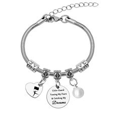 a silver bracelet with charms on it