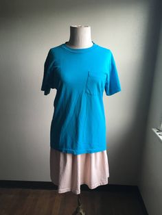 "1980s blue t shirt label- Fruit Of The Loom pre-shrunk cotton right breast pocket made in USA nicely worn-in very good vintage condition light collar stain soft and slightly faded label size M measures, lying flat, shoulder- 18\" chest- 19\" sleeve- 7\" length- 28 1/2\" mannequin measures- bust-36\", waist-27\"" T Shirt Label, Shirt Label, Army Pants, Leather Cowboy Boots, Blue T Shirt, Blue T, Blue Tshirt, Pocket Tee, The Loom