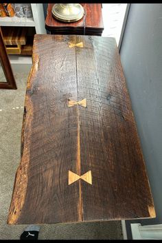 an old wooden table with arrows painted on it