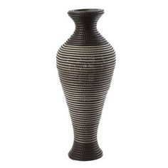 a black and white striped vase on a white background