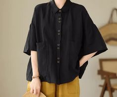 Black Relaxed Fit Cotton Blouse, Black Cotton Half Sleeve Blouse, Casual Black Half Sleeve Blouse, Black Half Sleeve Cotton Blouse, Black Short Sleeve Cotton Blouse, Black Cotton Blouse With Buttons, Black Relaxed Fit Blouse With Pockets, Casual Black Cotton Blouse, Casual Black Blouse With Pockets