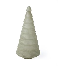 a white ceramic christmas tree on a white background