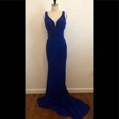 Gorgeous Never Worn Sapphire Blue Gown With Plunging Neckline, Open Back And Twisted Fabric Detailing. Blue V-neck Prom Gown, Blue V-neck Evening Dress With Sweep Train, Royal Blue V-neck Formal Gown, Blue V-neck Gown For Prom Season, Blue Evening Dress With Sweep Train For Night Out, Blue V-neck Maxi Dress For Gala, Blue V-neck Maxi Dress For Prom Season, Blue V-neck Evening Gown, Blue V-neck Gown