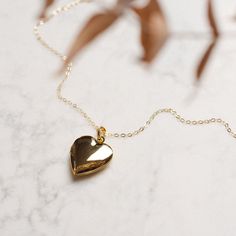 Keep love close to your heart with our Heart Locket Necklace. The 28mm gold-filled pendant, accompanied by an 18-inch chain gold-filled chain, combines classic elegance with a touch of sentimentality. It's a classic that's hard to beat! Heart Locket Necklace, Vintage Heart, Chain Gold, Heart Locket, Locket Necklace, Gold Filled Chain, Classic Elegance, Locket, Gold Filled