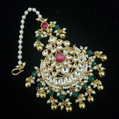 Kundan jewelry is 100% Handmade Indian Jewelry, best to wear it for traditional ceremonies or Indian weddings. This bridal jewelry has an ethnic finish. It has Polki Kundan stones with pearls in pink and green combinations. There are long and short patterns in Kundan jewelry. Maang tikkas give a glamorous outlook to traditional outfits. It has a Bollywood style to suit every occasion and goes really well with South and North Indian weddings.   Measurements: 7-8 inches long Color, shades, texture displayed may slightly vary from the actual product due to digital image limitations. We request you to consider these minor variations. Please expect the possibility of some slight imperfections when buying handmade jewelry. If you have any questions, please contact us. CARE: Keep jewelry away fro Traditional Kundan Tikka For Navratri, Festive Kundan Tikka For Ceremonial Occasions, Temple Jewelry Tikka With Latkans For Eid, Ceremonial Kundan Tikka For Festive Occasions, Festive Ceremonial Kundan Tikka, Navratri Kundan Tikka With Latkans, Traditional Kundan Tikka With Latkans, Traditional Kundan Tikka For Diwali, Traditional Kundan Tikka For Festivals