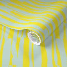 a yellow and white wallpaper with stripes on it