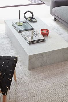 a modern living room with marble coffee table