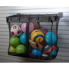 an over the door storage bag filled with balls