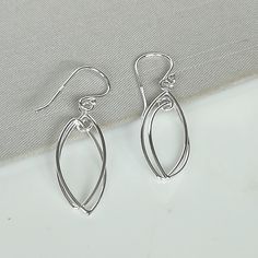 ▪︎ Sterling silver ear danglers. ▪︎ Dimensions :32.5x 9.5 mm Drop Length : 39 mm. ▪︎ These earrings are handmade with hypoallergenic 925 sterling silver ▪︎ I can send this piece in a gift box or include a gift message from you if required. ▪︎▪︎ Please read my shipping policies for shipping durations. ▪︎▪︎ Do contact me if you have any questions at nkapoor1955@gmail.com ➤ For more Pendants/Charms please visit https://www.etsy.com/shop/NeverEndingSilver?ref=seller-platform-mcnav§ion_id=24862996 ➤ Silver Linear Earrings As A Gift, Dainty Nickel Free Silver Linear Earrings, Hypoallergenic Sterling Silver Linear Earrings As Gift, Dainty Silver Teardrop Earrings As Gift, Minimalist Metal Teardrop Earrings As Gift, Nickel-free Modern Teardrop Earrings For Gift, Simple Teardrop Earrings As Gift, Simple Teardrop Earrings For Gift, Delicate Sterling Silver Linear Earrings For Gift