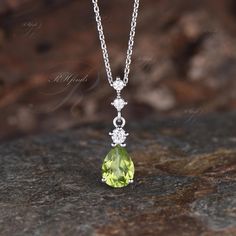 Product Detail Material: 925 Sterling Silver, 9K/14k/18k Solid Rose/White/Yellow Gold, Platinum Center Stone: 7x9mm Pear Cut Natural Peridot Side Stones: Round Cut Moissanites The necklace length can be adjusted from 16 inches to 18 inches Custom Service 1, Gemstones can be replaced with others. 2, All metal can be made. 3. All necklace lengths can be customized. 4, The pendant/necklace can be made according to the design you want. Please contact us if you need any personalized custom pendant/necklace. We will try our best to meet your needs. Only you can't think of it, we can't do it without us. Shipping It's made-to-order jewelry, it will take 2-4 weeks to make it. Once the pendant/necklace is finished, it will be sent by USPS, FedEx or DHL. Return & Refund There is a 30-day return guara Custom Pendant Necklace, Engagement Necklace, Custom Pendant, Handmade Pendant Necklace, Dangle Necklace, August Birthstone, Custom Pendants, Necklace Unique, White Gold Engagement