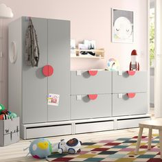 a child's playroom with toys and furniture in the room on the floor