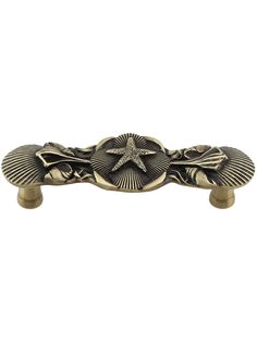 an antique brass door handle with a starfish on the center and two leaves in the middle