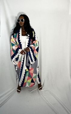 Rich Auntie at it's finest! Our fashion satin kimono can be worn as an oversized dress on it's own or cinched at the waist for a more fitted look. Flowy and colorful style definitely can make this a beach coverup or vacation look. In One Size fits most as the sleeves are open flowy and the kimonos have an open front. Size US Size One Size Chic White Kimono For Beach Cover-up, White Long Free Size Kimono, White Long Free-size Kimono, White Open Front Kimono For Day Out, White Long Robe For Vacation, White Long Sleeve Robe For Vacation, White Long Robe For Spring, Long Sleeve White Robe For Vacation, Long White Robe For Spring