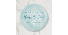 a round ornament that reads, matilda is ready to pop thank you for celebrating with me