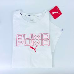 Brand New With Tag. White Tee With Front Orange Puma Lettering/Logo. Short Sleeves, Crew Neck, Size Small, 100% Cotton. Athleisure Cotton Tops With Puma Logo, Puma Logo Cotton Tops For Athleisure, Cotton Athleisure Tops With Puma Logo, White Puma Logo Top For Streetwear, White Puma Logo Crew Neck Top, Sporty White T-shirt With Puma Logo, Puma Logo Graphic Tee Short Sleeve, Sporty White Puma T-shirt, White Puma T-shirt For Sports