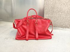 Red leather travel bag, Ladies duffle, Leather weekend bag, Custom luggage, Leather duffle bag, Red leather luggage, Travel duffle, NY made. More handmade leather travel bags, duffels, holdalls, carry alls, weekenders, overnight bags, weekend bags and luggage here: http://etsy.me/1eYE4hv About Leather This Red Leather is textured and thick but its more mailable than our standard leathers so it has a great relaxed look. But even though it has a less structured look the double leather bottom gives Red Travel Bag With Leather Handles, Luxury Red Travel Bag For Everyday Use, Red Large Capacity Satchel Duffle Bag, Red Duffle Bag With Luggage Sleeve For Overnight Trips, Red Tote Duffle Bag For Travel, Red Satchel Travel Bag, Red Leather Travel Duffle Bag, Red Leather Duffle Bag For Travel, Red Rectangular Weekender Bag For Trips