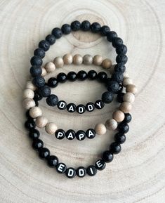 🖤This listing is for one bracelet. Perfect for gifting to the special man, daddy or papa in your life!  🖤Bracelets come in 8mm beads. Choose between three options: black lava beads, wood beads, or shiny black jasper. 🖤Letter beads are round and black with white letters and you can personalize the name you want!  Average men bracelet size:  7.5 Small 8.0 Medium 8.5 Large  9.0 Extra Large  🖤Each bracelet is custom made so all sales are final and no refunds will be issued. Please check all size and personalization ( if needed) prior to ordering.  🖤Tips: Do not get bracelets wet. They may tarnish. Please remove before showering or swimming.  To make it last long, roll the bracelet onto your wrist instead of pulling or stretching it on. Do not leave in direct sun. Store in a safe place whe Dad Bracelet, Beaded Bracelet For Men, Gift For Papa, Black Jasper, 8mm Beads, Men Bracelet, Lava Beads, Mens Beaded Bracelets, Bracelet For Men