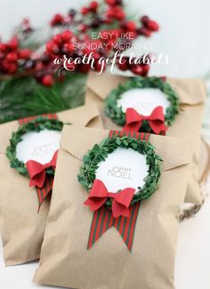 three brown paper bags with wreaths on them