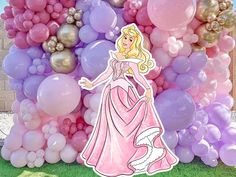 a princess standing in front of a bunch of balloons