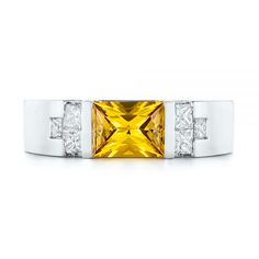 104023 18k White Gold Ring   Center Yellow Sapphire (not included in listed price)   6 PC Diamonds - .48 ctw   Clarity: VS2 - Color: F-G   Joseph Jewelry. This stunning men’s wedding ring features a princess cut yellow sapphire bar set in the middle, accented by princess cut white diamonds channel set on either side. It was created for a client from North Attleboro, MA, who reached out to us through the Ring Builder feature on our website to share his ideas for the kind of piece he wanted. Desig Mens Ring Designs, Engagement Rings For Men, Mens Ring, Mens Band, Channel Set, Bar Set, Yellow Sapphire, Yellow Diamond, A Princess