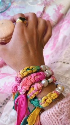 a close up of a person wearing bracelets