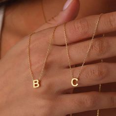 Description: Discover the elegance and versatility of our Stainless Steel Initial Necklace for Women. This exquisite choker features gold-colored cut-out letters, allowing you to personalize it with a single name, making it a unique and meaningful accessory. Perfect as a jewelry gift, this necklace is ideal for any special occasion or to add a personal touch to your daily style. Made from high-quality stainless steel, it ensures durability and resistance to wear, maintaining its shine and beauty over time. Features: Material: High-quality stainless steel Color: Gold Personalization: Initial or full name Design: Precisely cut-out letters Chain Length: Adjustable for a comfortable fit Ideal for: Gifts, special occasions, daily wear Care Instructions: To maintain the shine and beauty of your Affordable Round Jewelry With Initials, Affordable Initials Jewelry For Birthday Gift, Cheap Monogram Jewelry For Gifts, Cheap Personalized Metal Jewelry, Cheap Personalized Name Jewelry For Birthday Gift, Cheap Personalized Pendant Jewelry, Cheap Initials Jewelry For Birthday Gift, Initial Necklace Aesthetic, Letter Necklace Gold