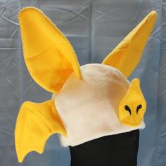 Ultrasoft fleece LEAF NOSED BAT hat with large freestanding, 3D ears, a solid base in natural colors, fun bat wings on the sides, and a 3D leaf nose and stenciled nostrils.  This hat's cozy layers will keep you warm through the coldest days! Perfect for cold weather outdoor fun, a costume, or to make a statement.  Will fit most adults.  Multiple color variations are available so PLEASE specify which color style is preferred. If choosing the Custom Colors option, please write your color choices i Leaf Nosed Bat, Bat Hat, Grey Fox, Fleece Hat, Super Happy, Natural Colors, Multiple Color, Outdoor Fun, Bat Wings