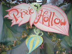 a sign that says,'pixie hollow'on the side of a building