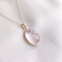 This stunning Pendant is set in 14k Solid Yellow Gold with Natural Morganite with utmost precision. It is a unique gemstone Pendant for nearly every occasion and is completely hassle-free jewelry. ITEM DETAILS: * Gem: Morganite * Gem Size: 15X19mm * Gem Shape: Oval * Gem Weight: 18.94 carats * Gold Purity: 14KT * Gold Weight: 0.65 gram * Total Weight of the Pendant: 4.44 gram The Gold purity is guaranteed and it comes with authentic 14KT gold hallmark. Since my items are handmade, they are absolutely nickel and lead free. CUSTOMIZATION: * Gemstone customization is available and it can be substituted with a gem of your choice. Kindly message me for the same. PACKAGING * The Pendant comes with layers of safe and secure wrapping along with Free handmade jewelry box with every purchase. ➡️Head Luxury Morganite Gemstone Jewelry, Round Gold Gemstones Fine Jewelry, Dainty 14k Gold Jewelry With Natural Stones, Faceted 14k Gold Round Jewelry, Morganite Fine Jewelry In Yellow Gold, Formal Yellow Gold Morganite Jewelry, Delicate 14k Gold Gemstone Jewelry, Gold Round Gemstones For Anniversary, Luxury Gold Morganite Jewelry