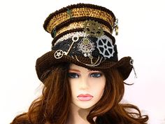 This Steampunk top hat adds a fun and funky Victorian feel to your renfair costume, a Steampunk festival outfit, a convention, a concert, or just for fun! Crocheted by hand, I've worked this in an ombre from brown to rusty gold, with bands of brown and a brown brim. Gears and keys abound, including the brim and on the ridges, as well as a spare pair of tailors shears dangling at the top. I've also wired the brim so you can play with different looks. Made from premium acrylic, you can wear this hat all year. Firm enough to hang on a peg or rest on your shelf without losing shape, soft and comfortable on your head. This hat has some stretch for an adjustable head size fit. -6" rise, 2" wired brim -Fits 21-23.5" head circumference How to measure your head: - Using a fabric tape measure or a s Steampunk Brimmed Mini Hats For Costume Party, Steampunk Brimmed Mini Hats For Cosplay, Steampunk Brimmed Costume Hats For Themed Events, Steampunk Brimmed Hat For Themed Events, Steampunk Brimmed Costume Hat For Cosplay, Steampunk Brimmed Hat For Halloween, Steampunk Costume Hat With Curved Brim, Steampunk High Crown Hat For Themed Events, Steampunk Brimmed Halloween Hats