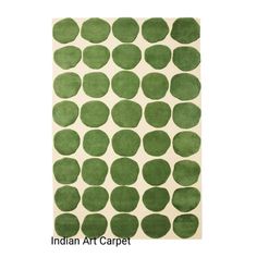 an area rug with green circles on the side and white back ground, in front of a