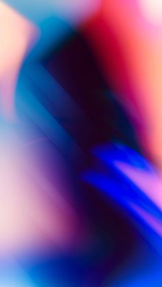 blurry photograph of an abstract background in blue, red and pink