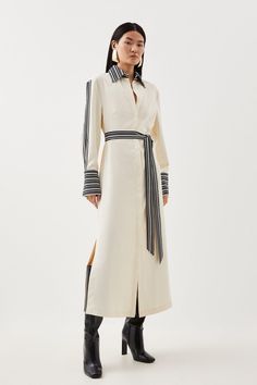 Balanced Proportions Are Spotlighted By This Midi Dress, Flowing Over The Silhouette With A Lightweight Twill Construction. Characterised By Striped Borders To The Long Batwing Sleeves, Self-Tie Belt, And Collared V-Neck Bodice, This Piece Pairs Best With Streamlined Stilettos For A Truly Polished Effect.Collared V-Neckbatwing Sleevesmidi Lengthself-Tie Belt Grey Shirt Dress Outfit, Business Formal Dresses, Shirt Dress Styling, Cloth Belts, Midi Long Sleeve Dress, Cutwork Dress, Stripe Shirt Dress, Wardrobe Minimalist, Striped Casual Dresses